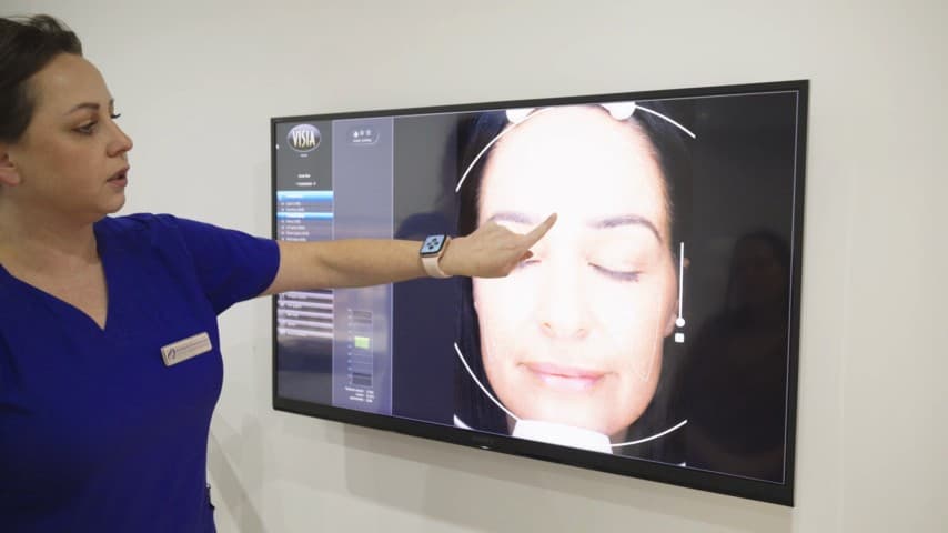 Clinician demonstrating VISIA skin analysis technology at Berkshire Aesthetics